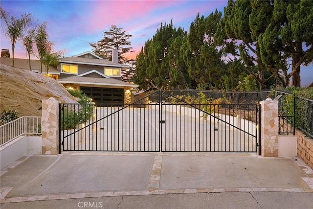 view of gate at dusk