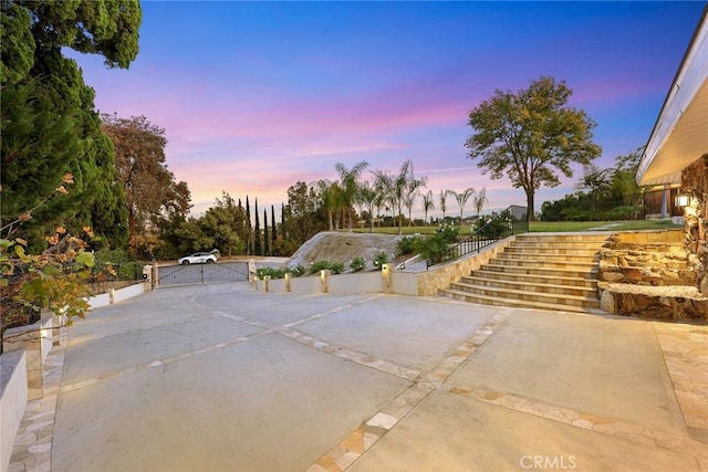 view of patio terrace at dusk