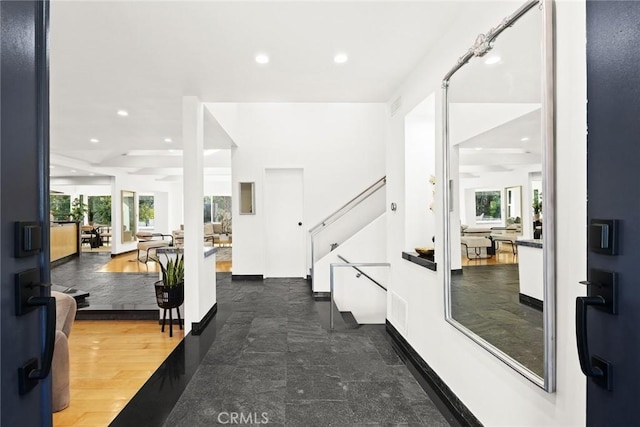 foyer entrance with dark hardwood / wood-style floors