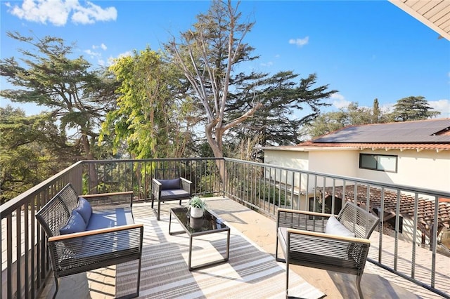 wooden terrace with outdoor lounge area