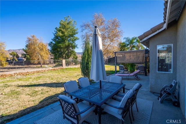 view of patio / terrace featuring a mountain view