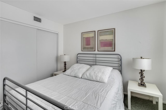 carpeted bedroom featuring a closet