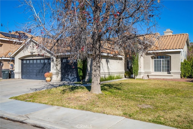 view of front facade with a garage and a front yard