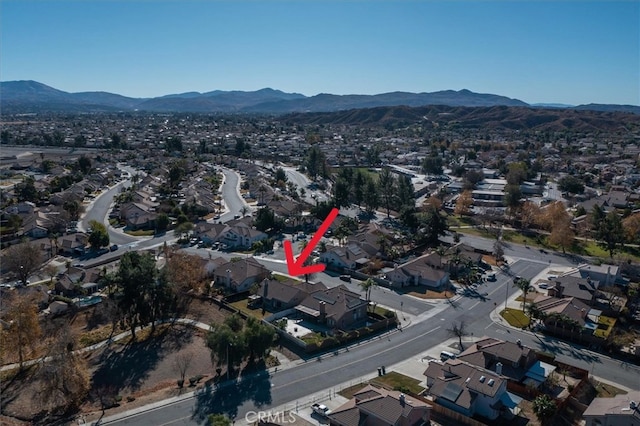 birds eye view of property with a mountain view