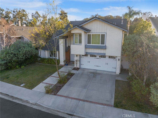 view of front facade with a garage and a front yard