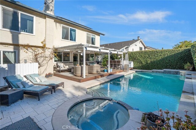 view of swimming pool featuring outdoor lounge area, a pergola, an in ground hot tub, and a patio