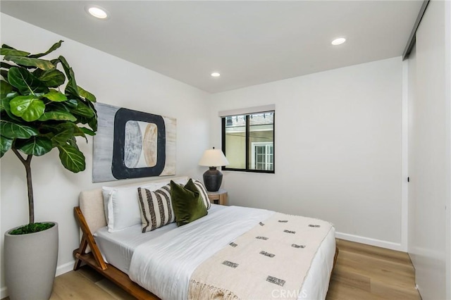 bedroom with light hardwood / wood-style floors