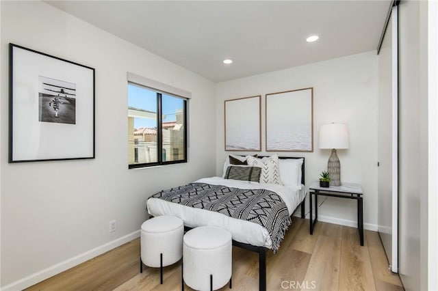 bedroom with light hardwood / wood-style floors