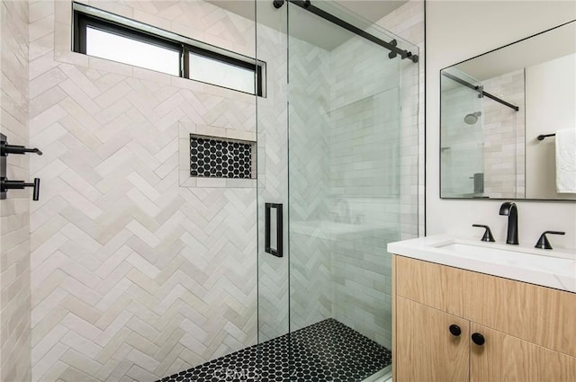 bathroom with vanity and an enclosed shower