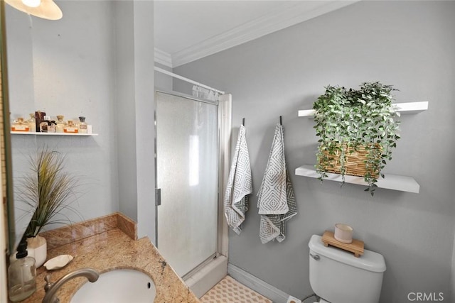 bathroom featuring toilet, a shower, sink, and ornamental molding