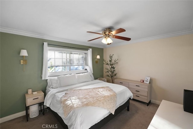 bedroom with ceiling fan, dark carpet, and crown molding