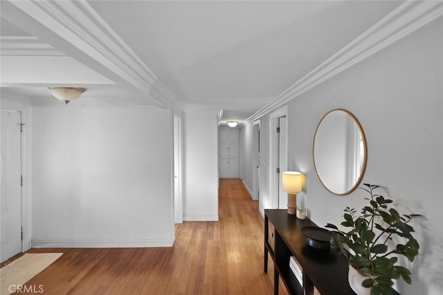 hallway featuring crown molding and light wood-type flooring