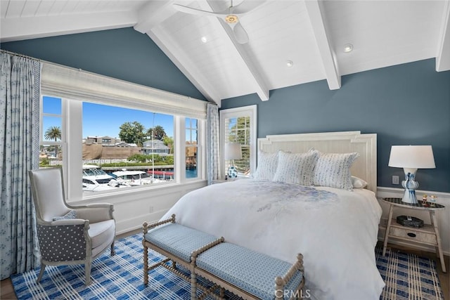 bedroom with vaulted ceiling with beams, ceiling fan, and hardwood / wood-style flooring