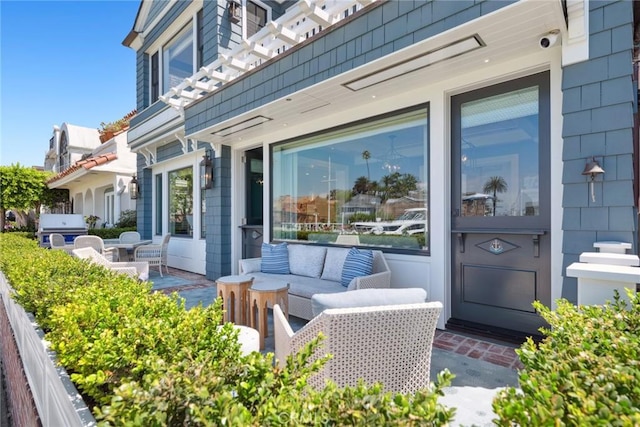 exterior space with an outdoor living space and a patio area