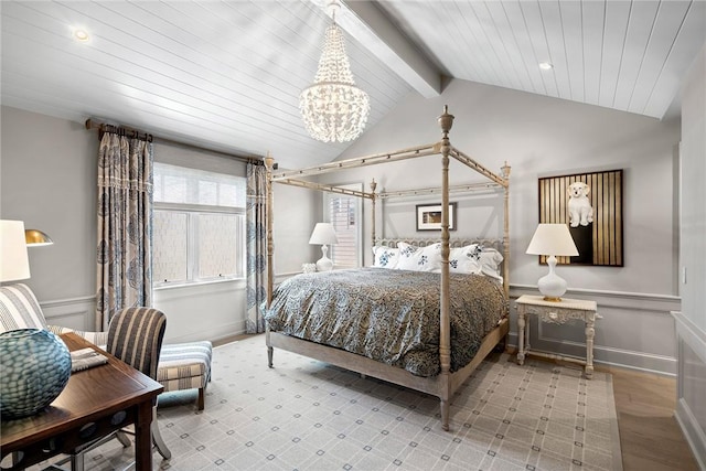 bedroom featuring vaulted ceiling with beams and a notable chandelier