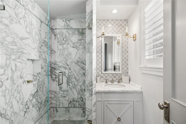 bathroom with vanity and an enclosed shower