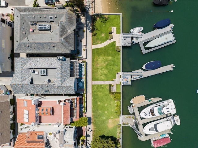 birds eye view of property featuring a water view