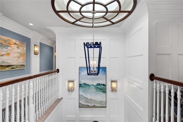 interior space with ornamental molding and an inviting chandelier