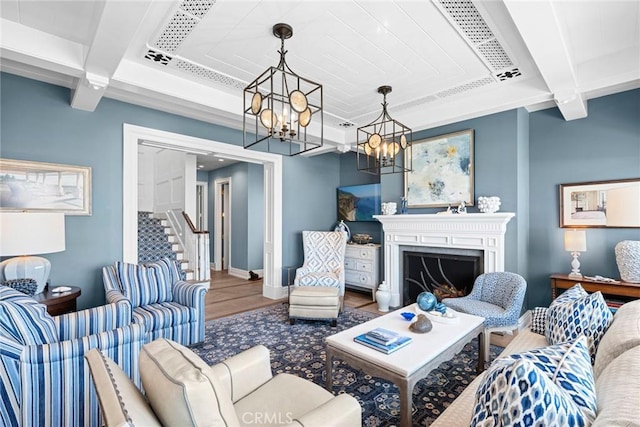 living room with beam ceiling and a chandelier