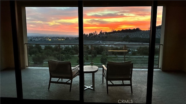 view of balcony at dusk