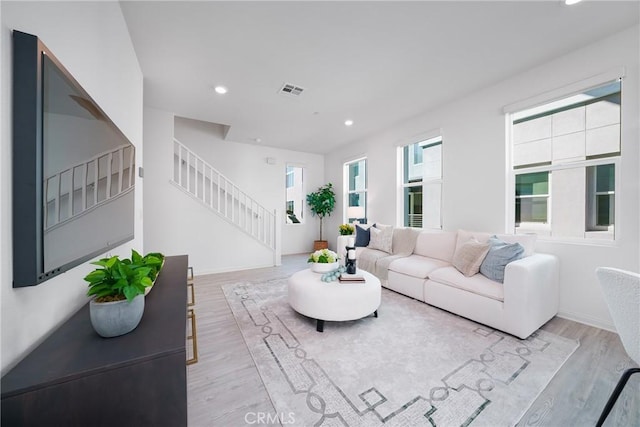 living room with light hardwood / wood-style flooring