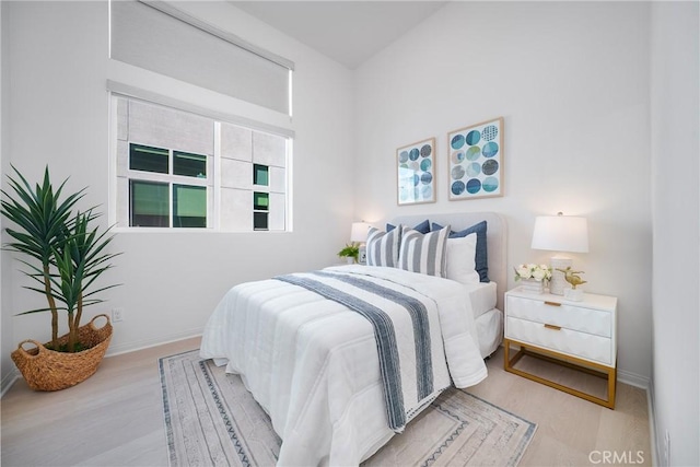 bedroom with light hardwood / wood-style flooring