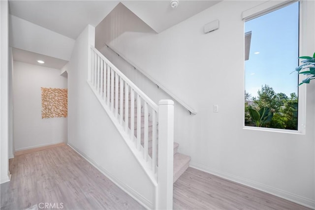 stairway featuring hardwood / wood-style floors