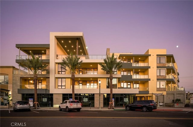 view of outdoor building at dusk