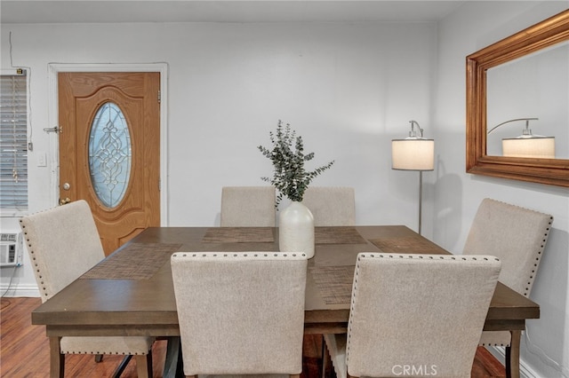 dining space featuring dark wood-type flooring