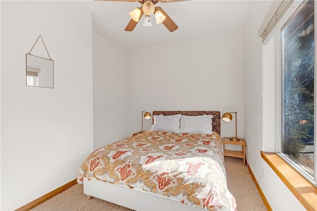 bedroom featuring light carpet and ceiling fan