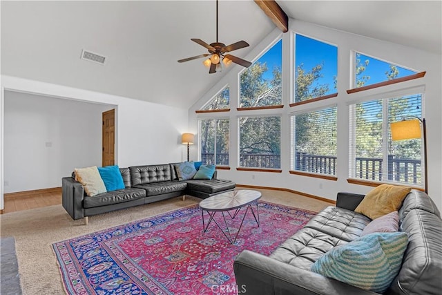 living room with ceiling fan, carpet flooring, beamed ceiling, and high vaulted ceiling