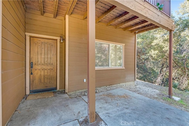 entrance to property with a patio area and a balcony