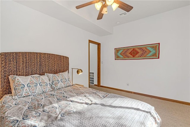 bedroom featuring ceiling fan and carpet