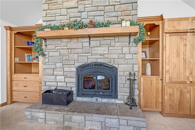 room details with built in features, a wood stove, and carpet floors