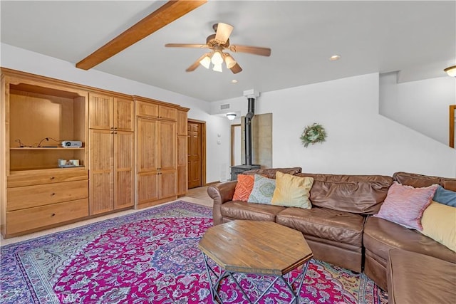 living room featuring ceiling fan and beam ceiling