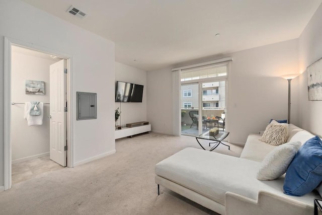 carpeted living room with electric panel