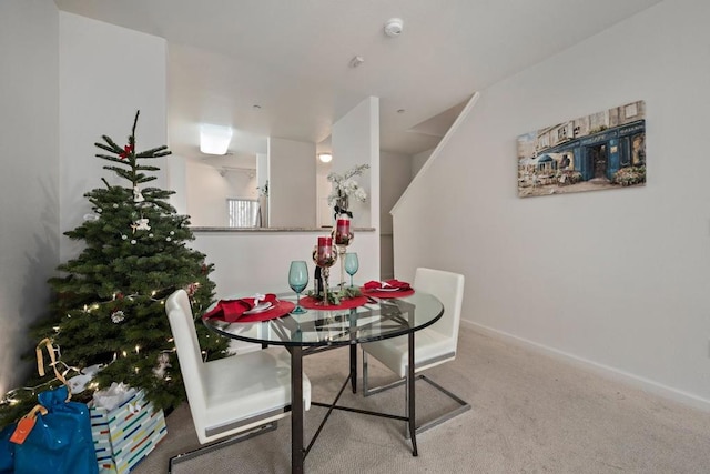 dining space featuring carpet floors