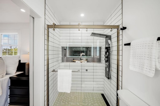 bathroom featuring toilet and walk in shower