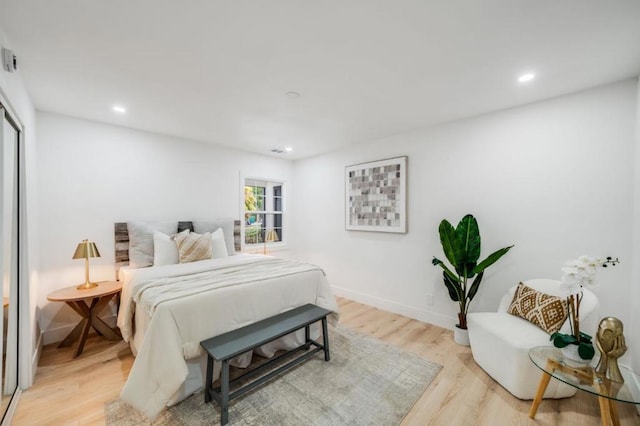 bedroom with light hardwood / wood-style flooring