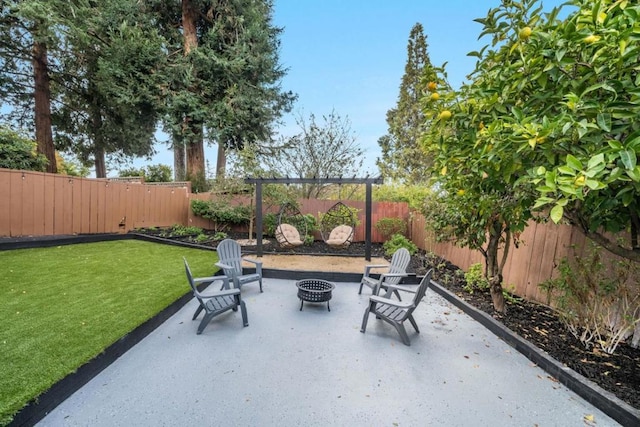 view of patio featuring a pergola and a fire pit