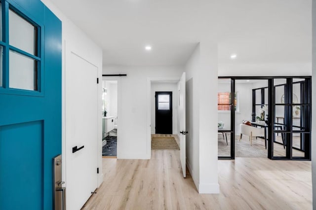 hall with light wood-type flooring