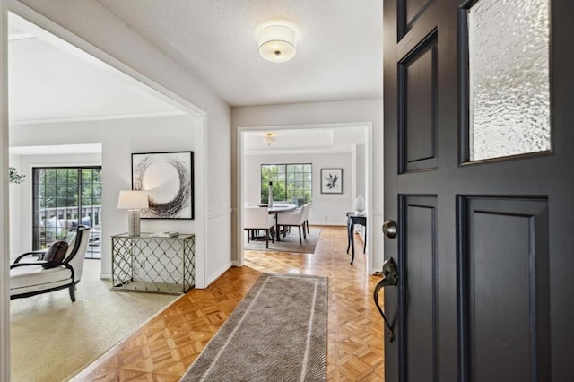 foyer featuring parquet floors