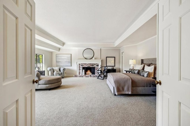 carpeted bedroom with a raised ceiling