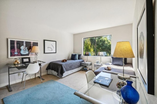 bedroom featuring light colored carpet