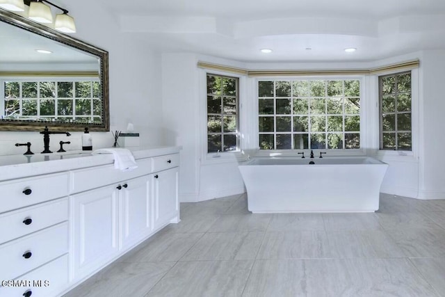 bathroom with a bath and vanity