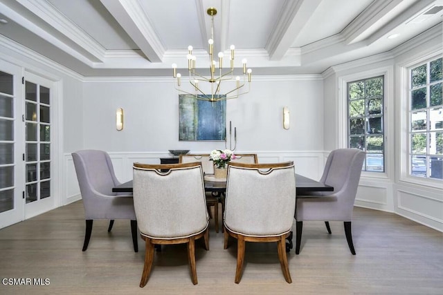 dining room with hardwood / wood-style floors, crown molding, a notable chandelier, and beam ceiling