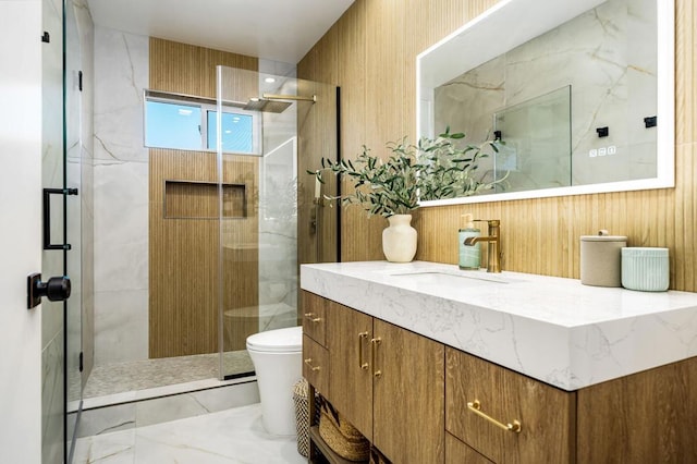 bathroom featuring an enclosed shower, vanity, and toilet