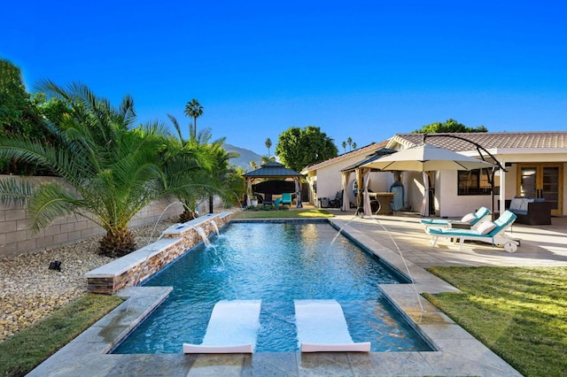 view of swimming pool with a gazebo, a diving board, pool water feature, and a patio