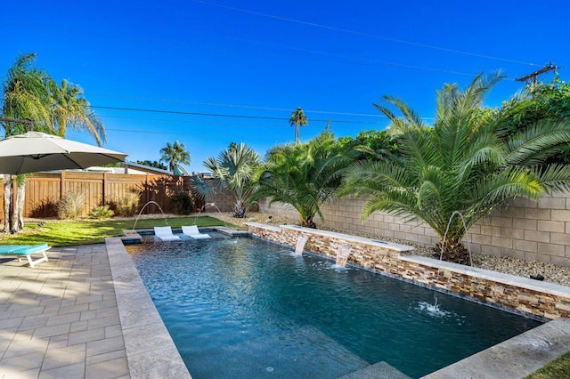 view of pool with pool water feature and a patio