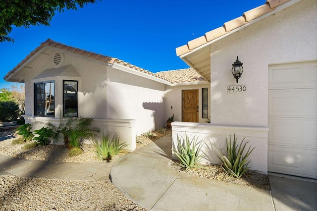 entrance to property featuring a garage